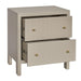 [Brand] beige chest with two open drawers, gold knobs.