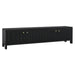 Black media console with gold knobs by [Brand].