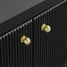 Black [Brand] cabinet with textured doors and gold knobs.