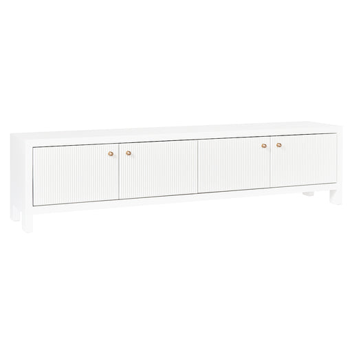 White [Brand] media console with grooved doors, gold knobs.