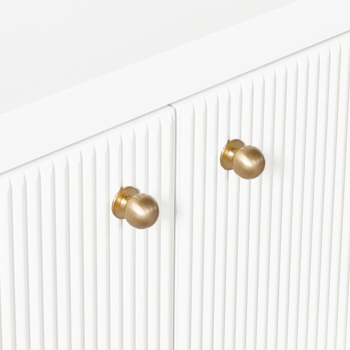 [Brand] white cabinet with gold knobs and vertical grooves.