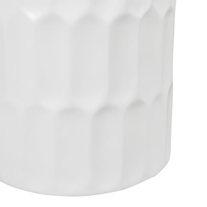 White [Brand] vase with textured geometric pattern, close-up view.