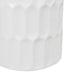 White [Brand] vase with textured geometric pattern, close-up view.