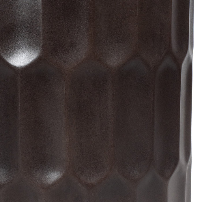 Dark textured ceramic surface with hexagonal pattern by [Brand].