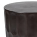 Dark cylindrical table by [Brand] with textured surface design.