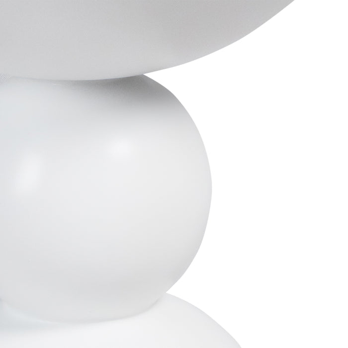White abstract sculpture with rounded shapes by [Brand].