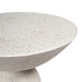 Terrazzo round table from [Brand] with speckled design, side view.
