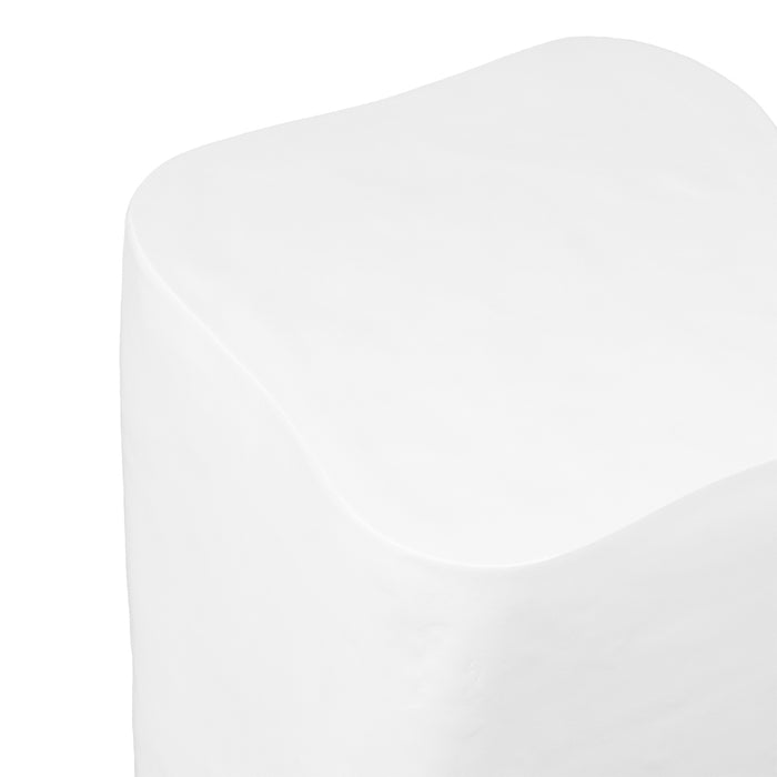 [Brand] white cube stool with rounded, smooth edges visible.