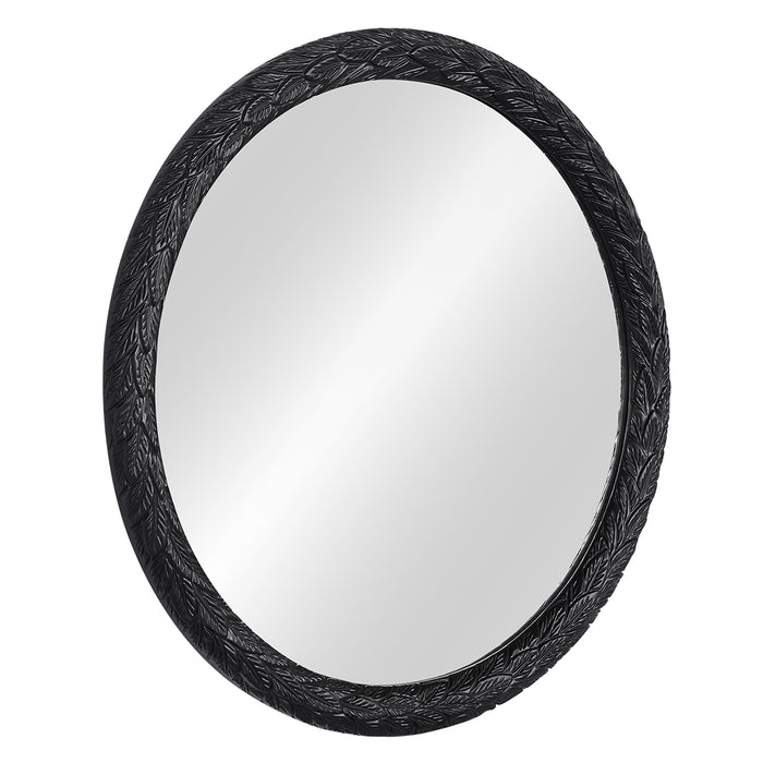 Mirror with ornate black frame featuring intricate leaf design. [Brand]