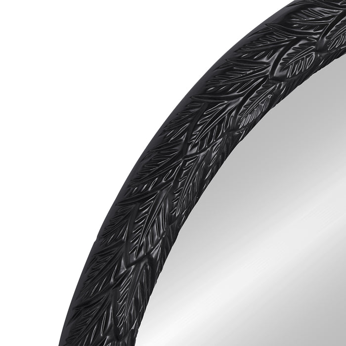 [Brand] mirror with black leaf-patterned decorative circular frame.