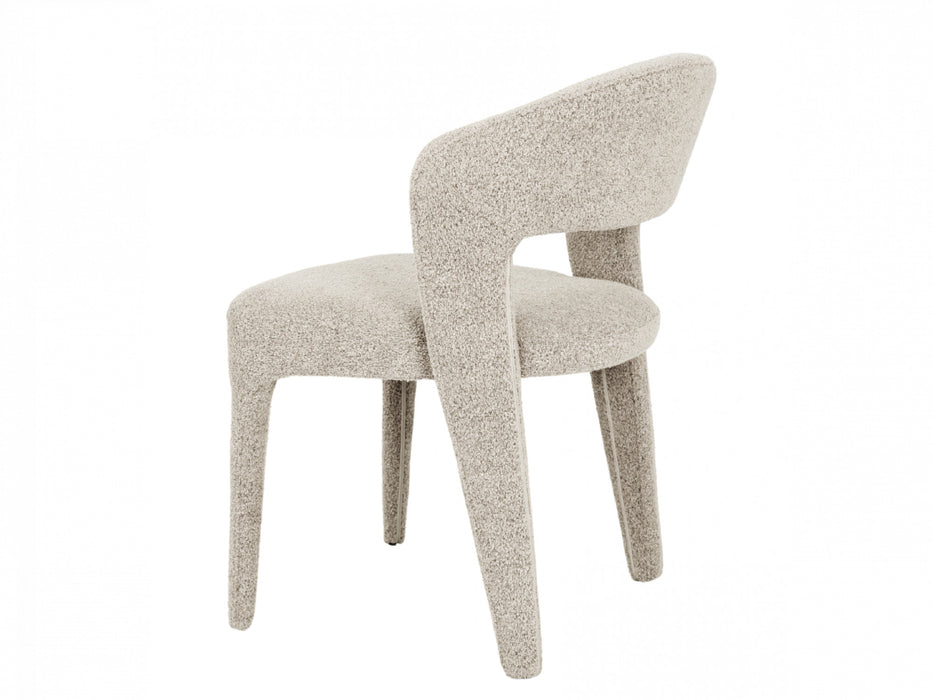 Modern beige boucle chair by [Brand], featuring curved design.