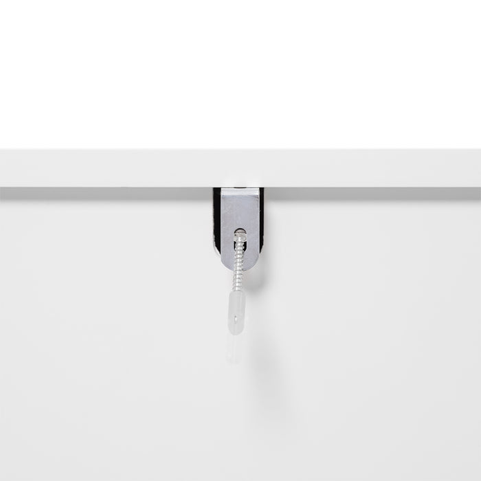 [Brand] white tabletop with sleek metal cable grommet.
