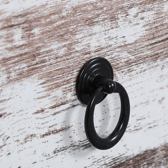 Rustic wooden cabinet with [Brand] black metal ring handle.