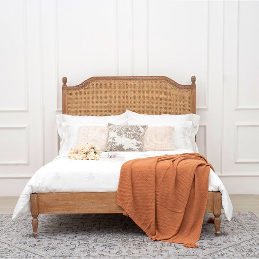 Marseille rattan bed styled in a bedroom