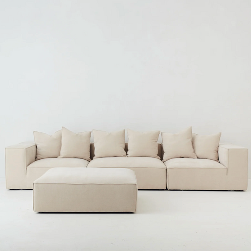 Cosmos Ottoman Oatmeal in modular sofa setting