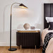 Brand floor lamp beside modern bedside table with decor.