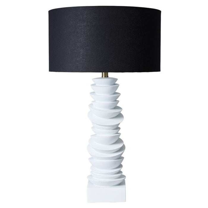 [Brand] sculptural white table lamp with black lampshade.