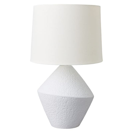 White [Brand] lamp with textured geometric base and shade.