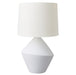 White [Brand] lamp with textured geometric base and shade.