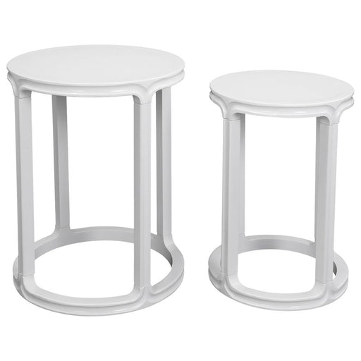 [Brand] white nesting tables set with round tops and bases.