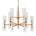 [Brand] chandelier with gold frame and cylindrical glass shades.