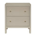 [Brand] beige nightstand with two ribbed drawers, brass knobs.